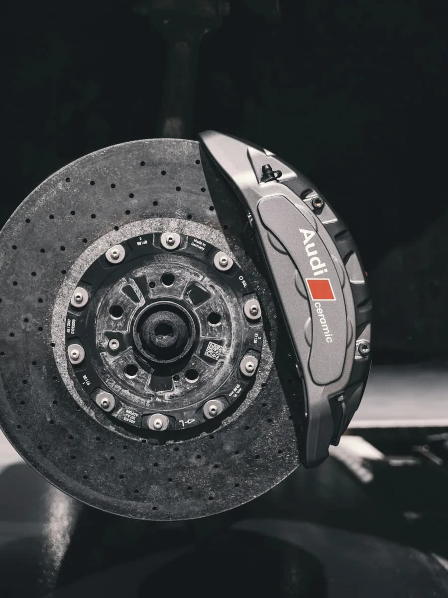 Carbon-ceramic brake disc and grey caliper, close up